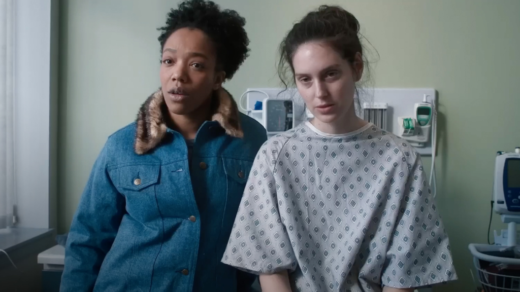 Sorry, Baby (2025) - Lydie (Naomi Ackie) and Agnes (Eva Victor) in the doctor's office still
