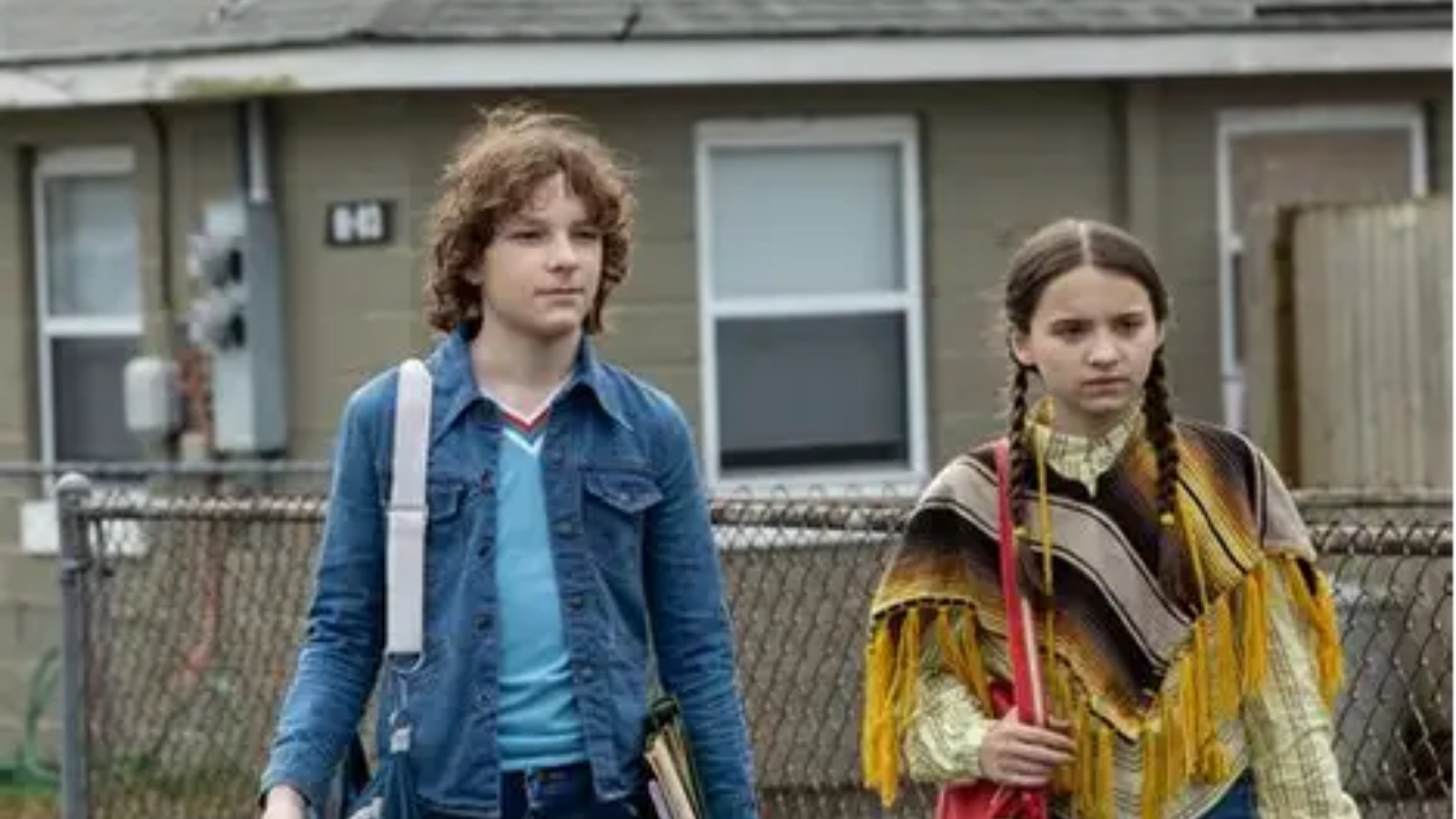 The Black Phone (2021) - Finn (Mason Thames) and Gwen (Madeleine McGraw) walking down the street still