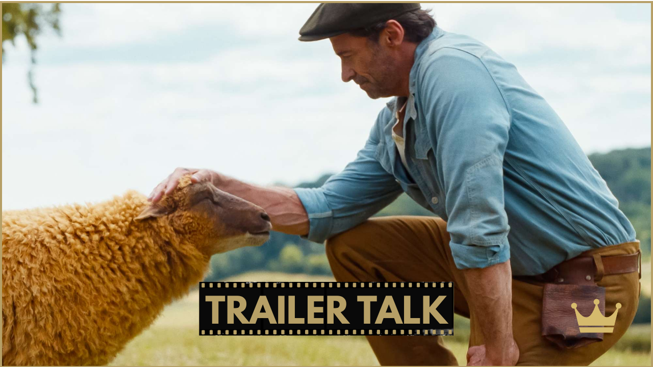 The Sheep Detectives (2026) - Hugh Jackman kneeling beside a sheep in a field with Trailer Talk branding for The Sheep Detectives
